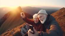 Senior tourist couple man and woman hiking and taking selfie at top beautiful mountains, sunset light