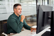 © insta_photos - Busy mature professional business man looking at pc monitor working at desk. Serious mid aged executive manager investor using computer thinking on digital financial market analysis in office.