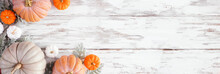 Fall Corner Border Of Assorted Pumpkins And Soft Green Leaves Over A Rustic White Wood Banner Background. Top View With Copy Space.