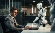 At a robotics company, a male businessman works at a laptop in his office, with prototypes of robots on his desk.