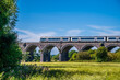 A view of a train starting across the Souldern viaduct in Oxfordshire, UK in summertime