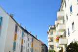 Fototapeta Kwiaty - apartment buildings with balconies and blue sky, urban city life in germany, hanover