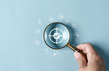 Leinwandbilder - Magnifying glass focus to target icon which for start up, creative, idea, innovation, motivation planning development leadership and customer target group concept.