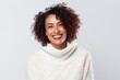 © Anne Schaum - Medium shot portrait photography of a Colombian woman in her 40s wearing a cozy sweater against a white background