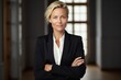 © Anne Schaum - Portrait photography of a Swedish woman in her 40s wearing a sleek suit against a minimalist or empty room background