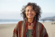 © Anne Schaum - Group portrait photography of a Peruvian woman in her 60s against a beach background