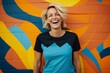 © Anne Schaum - Portrait photography of a Swedish woman in her 40s wearing a fun graphic tee against an abstract background