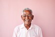 © Anne Schaum - Medium shot portrait photography of a Peruvian man in his 90s wearing a simple tunic against a pastel or soft colors background