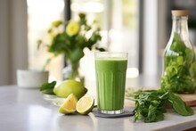 Healthy Green Smoothie Or Shake Made Out Of Fresh And Organic Lime And Lemon On A Kitchen Counter Top