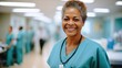 © visoot - Portrait of African American nurse smiling in a hospital.