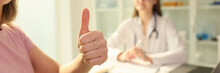 Woman Patient Shows Thumbs Up While Sitting Near Female Doctor In Clinic.
