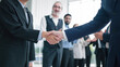 © M Stocker - Close up shaking hands of business people close deal making agreement after successful meeting. Business partners shake hands. Business workers clapping hands on background. Partnership concept