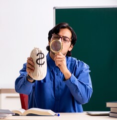 Sticker - Young male teacher in front of chalkboard