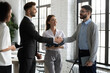 Happy male business partners shake hands get acquainted greeting in office, smiling businessmen handshake close deal or make agreement after successful negotiation, partnership concept