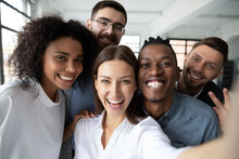 Close Up Of Happy Diverse Multiracial Colleagues Have Fun Make Self-portrait Picture On Cell At Work Together, Smiling Multiethnic Coworkers Laugh Pose For Selfie In Office, Friendship Concept