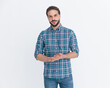 © Viorel Sima - handsome casual man with beard in plaid shirt rubbing palms