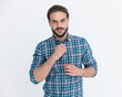 © Viorel Sima - sexy young man with beard unbuttoning casual plaid shirt