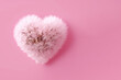 dandelion flower  in heart shape on pink background banner with copy space