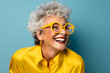 © Oksana_Latysheva - Happy smiling elderly woman portrait in bright clothes isolated on background