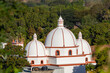Sunrise light completely illuminating the famous three domes of catholic church in Pespire City
