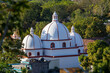 Sunset light giving tridimensional aspect to a church thas has three domes, the second oldest in Latin America