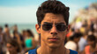 young adult Caucasian man, wearing sunglasses, mass tourism, tourists and crowds on the sandy beach, sun and heat, summer hot warm temperatures, many people, busy crowd, latina hispanic man, grin