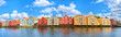 Panoramic view of old colorful wooden houses over the Nidelva river in Trondheim, Norway
