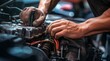 © Gegham - close-up of a auto mechanic repairing engine, close-up car engine, auto mechanic hands fixing car engine, mechanic fixing car