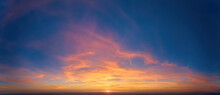 Fire On The Sky: From High Above, Far Sunset And Orange And Red Colored Streakes Of Cirrus Clouds On Deep Blue Evening Sky.  Ideal For Sky Replacement Projects, No Obstacles In The Front.