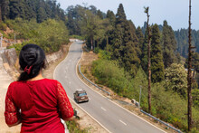 Female Tourist Enjoys An Aerial View Of Mountain Highway Road With Scenic Landscape At Lava In The District Of Kalimpong India