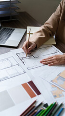 Engineer or interior Architects designer construction plans on blueprint.