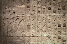 Old Egyptian Hieroglyphs On An Ancient Background. Horizontally. 