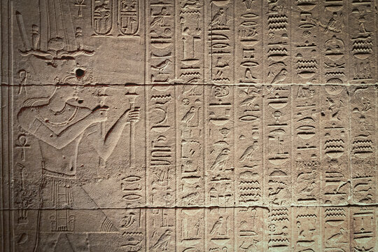 Old Egyptian hieroglyphs on an ancient background. Horizontally. 