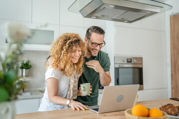 happy couple man and woman husband and wife morning routine use laptop