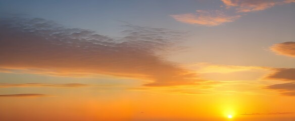 Wall Mural - オレンジ色の夕焼けの美しい空と雲。グラデーションする空の色