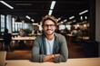 © NikoG - Smiling portrait of a happy young caucasian man working for a modern startup company in a business office