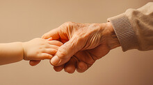 Image Of An Old Man And A Baby Holding Hands.