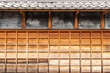 Gradient color wooden wall of traditional Japanese house with tiled roof
