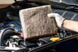 Repair and check car air conditioning system Technician holds car air filter to check cleanliness Clogging dirty or replacing the filter. Engine and transportation industry