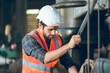 © chokniti - foreman with hard hat working vest on a construction site, middle aged or older technician engineer man in industrial factory, Professional heavy industry worker wearing uniform, men at work concept