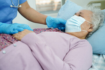 Wall Mural - Doctor check Asian elder senior woman patient wearing a mask for protect covid coronavirus.