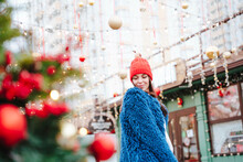 Smiling Woman Wearing Blue Coat Standing In City
