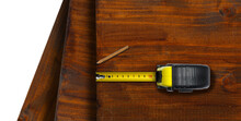 Close-up Of A Yellow And Black Tape Measure And A Pencil On Wooden Boards, Isolated On White Or Transparent Background With Copy Space. Png.