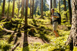 © Westend61 - Hiker with backpack exploring in forest