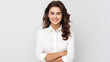 © Vahid - brunette business lady in white shirt smiling confident and cheerful with folded hands, isolated on white background.