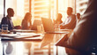 © Vahid - Panoramic view of business meeting in boardroom. Focus on office table and blurred people on backdrop.