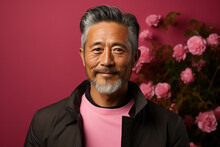 Studio Portrait Of Handsome Middle Age Asian Man Standing On Different Colours Background