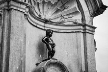 Brussels, B, Belgium - August 2023: Manneken Pis Is Fountain With Statue Of Pissing Boy