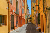 Fototapeta Uliczki - Picturesque narrow streets with colorful traditional houses in the old town of Menton, French Riviera, South of France