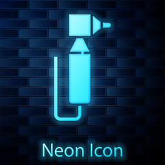 Poster - Glowing neon Tooth drill icon isolated on brick wall background. Dental handpiece for drilling and grinding tools. Vector